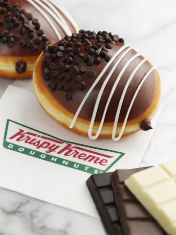 Chocolate lovers rejoice! Krispy Kreme has combined the smooth taste of three decadent chocolate flavors into one scrumptious new chocolate treat. The Krispy Kreme Triple Chocolate doughnut is available now through January 25, 2015 at participating Krispy Kreme US and Canadian Shops. (Photo: Business Wire)