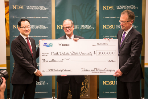 Doosan and Bobcat Company present a check to NDSU signifying their $3 million share of the scholarship endowment contribution. From left: Scott Park, president and CEO of Doosan Infracore Bobcat Holdings Co., Ltd.; NDSU President Dean Bresciani; Rich Goldsbury, president of Bobcat Company and Doosan, North America and Oceania. (Photo: Business Wire)