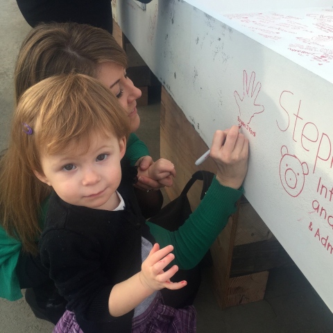 Rowan, born two years ago at Lucile Packard Children's Hospital Stanford, leaves her mark on the final steel beam of the hospital's expansion, January 14, 2015. (Photo: Business Wire)