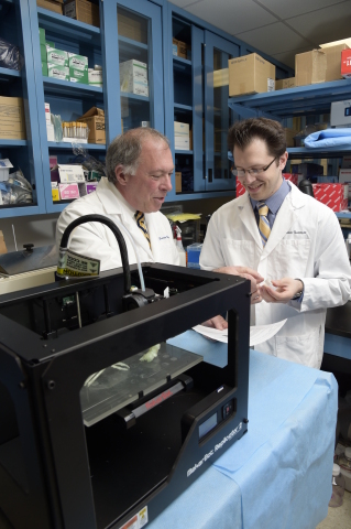 Daniel A. Grande, PhD, director of the Orthopedic Research Laboratory at the Feinstein Institute, and Todd Goldstein, an investigator at the Feinstein Institute, part of the North Shore-LIJ Health System, with their MakerBot Replicator Desktop 3D Printer that they used to 3D print cartilage to repair tracheal damage. (Photo: Business Wire)