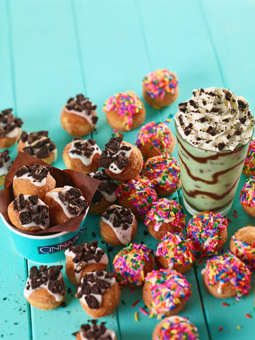 Cinnabon has introduced two new frosted treats to the CinnaSweeties lineup: Frosted CinnaSweeties with Oreo cookie pieces and Frosted CinnaSweeties with sprinkles. (Photo: Business Wire)