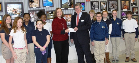 Dr. Ed Duffy, the Executive Director of the STEM Development Foundation, presents a check to Saluda Trail Middle School Principal Brenda Campbell in recognition of the school's outstanding STEM program. (Photo: Business Wire)