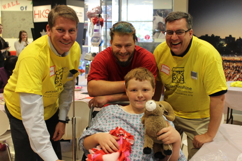 Volunteers from UnitedHealth Group brought a HeARTS-themed party to the patients and families at Children's Healthcare of Atlanta. David Sturkey, vice president, UnitedHealthcare Key Accounts, South Atlantic, and Garland Scott, CEO, UnitedHealthcare - South Atlantic with a young patient at today's Project Sunshine party (Photo courtesy of Project Sunshine).