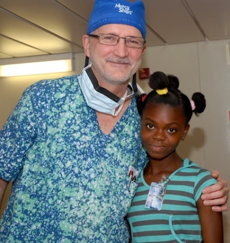 Dr. Gary and Hawa - Mercy Ships Doctor and Patient. New app increases volunteer registrations by 20%. (Photo: Business Wire)