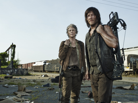 Actors Norman Reedus and Melissa McBride in The Walking Dead on AMC (Photo: Business Wire)