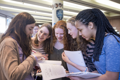 Intel Science Talent Search finalist and high school senior Kalia Firester (left) inspires her freshman classmates who travelled from Hunter College High School in New York to Washington, D.C. to cheer her on. Photo credit: Chris Ayers/Intel