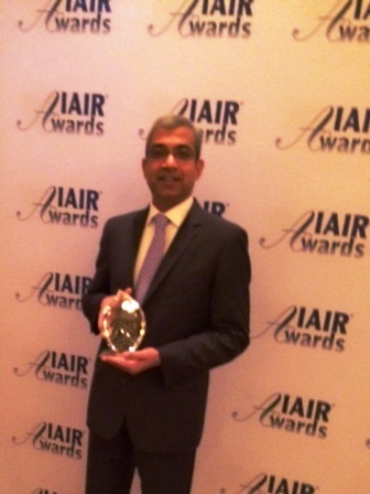 Ashok Vemuri, President & CEO, IGATE Corporation with winner's trophy at IAIR Awards - 2014 (Photo: Business Wire)