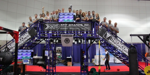 Participants climb the UTC-K2 for group photo after an early morning, 20 station Throwdown workout at IHRSA Convention (Photo: Business Wire)