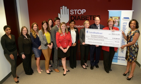 Jocelyn Chisholm Carter of UnitedHealthcare (right) presents a $25,000 check to Rena Cozart, executive director, American Diabetes Association of Atlanta, that will be used for community outreach efforts to educate more than 10,000 people in the Atlanta region about diabetes prevention and care, including a major diabetes education initiative during the Atlanta Gospel Fest 10th Annual Healthcare & Music Festival. UnitedHealthcare donated $106,000 to 11 organizations in Georgia, and are part of UnitedHealthcare's efforts to develop solutions that help care for the economically disadvantaged, the medically underserved and people who lack access to employer-funded health care coverage (Photo: Wingate Downs).