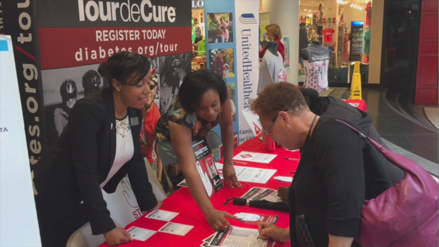 Jocelyn Chisholm Carter of UnitedHealthcare (top right) and Leslie Potts of the American Diabetes Association of Atlanta (left), help local residents learn about diabetes during a community outreach campaign to educate more than 10,000 people in the region about diabetes prevention and care. The initiative is being funded through a $25,000 grant by UnitedHealthcare to the ADA. UnitedHealthcare donated $106,000 to 11 organizations in Georgia, and are part of UnitedHealthcare's efforts to develop solutions that help care for the economically disadvantaged, the medically underserved and people who lack access to employer-funded health care coverage (Video: Kevin Herglotz).