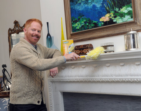 Jesse Tyler Ferguson uses a Swiffer 360 Duster, Unscented to reduce inanimate allergens while spring cleaning, Monday, March 23, 2015, in New York. The product is the first in its category to be Certified asthma & allergy friendly by the Asthma and Allergy Foundation of America.  (Photo by Diane Bondareff/Invision for Procter & Gamble/AP Images)