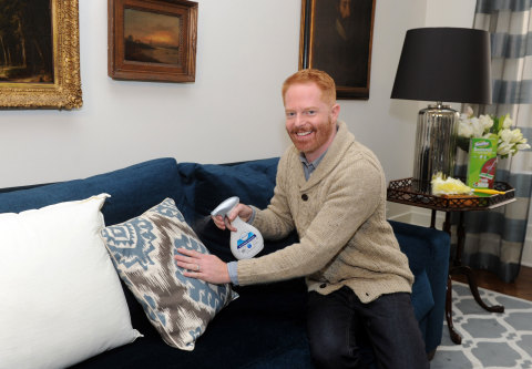 Jesse Tyler Ferguson uses Febreze Fabric Refresher Allergen Reducer, Unscented to reduce inanimate allergens while spring cleaning, Monday, March 23, 2015, in New York. The product is the first in its category to be Certified asthma & allergy friendly by the Asthma and Allergy Foundation of America.  (Photo by Diane Bondareff/Invision for Procter & Gamble/AP Images)