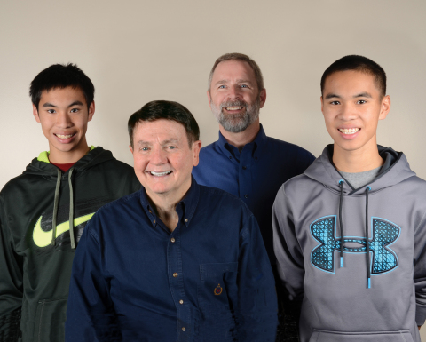 Bob Page and Dale Frederiksen, with their sons (Photo: Business Wire)