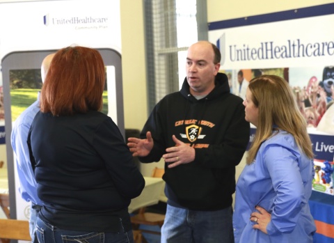 Mayor John McNally talks with a group of moms about importance of pre- and post-natal care at the Citywide Baby Shower in Youngstown, OH. The event was hosted by UnitedHealthcare and the City of Youngstown Office on Minority Health. (Photo Credit: Emmett King)