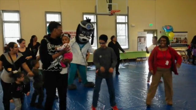 Kids, moms and moms-to-be attending the Youngstown, OH Citywide Baby Shower and Health Fair take a break to stretch their legs and join UnitedHealthcare mascot Dr. Health E. Hound in a fun, healthy dance. The Citywide Baby Shower was hosted by UnitedHealthcare and the City of Youngstown Office on Minority Health. (Video Credit: UnitedHealthcare)