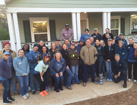 The team from TRC Staffing Services, Inc. helps complete the first Habitat for Humanity house built in Atlanta in 2015. (Photo: Business Wire)