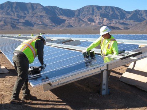 Electricians from construction company Cupertino Electric install the millionth solar module at Copper Mountain Solar 3 in Nevada, marking a key milestone in the 250-MW project built in conjunction with Amec Foster Wheeler for Sempra U.S. Gas & Power and Consolidated Edison Development. (Photo: Business Wire)