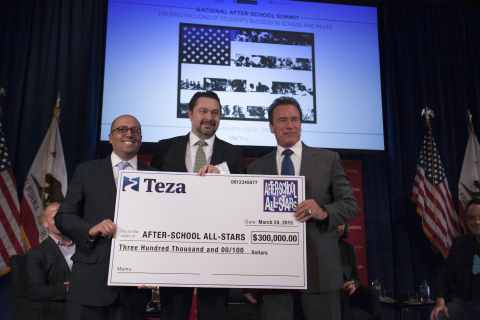 Misha Malyshev presents check to After-School All-Stars. From left: Ben Paul for ASAS, Misha Malyshev for Teza Technologies and Arnold Schwarzenegger. (Photo: Business Wire)