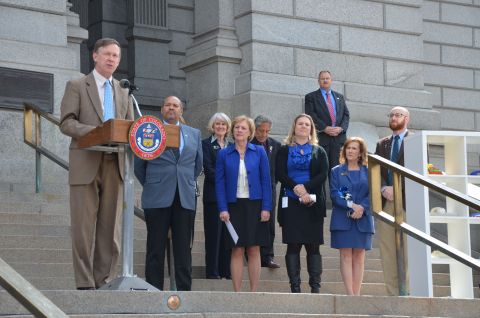 Governor John W. Hickenlooper, members of Colorado's legislature and child advocates today marked National Child Abuse Prevention Month by launching Colorado's first statewide child abuse and neglect hotline: 1-844-CO-4-KIDS. (Photo: Business Wire)