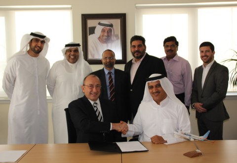Ron Peri, Ghaith Al Ghaith and the flydubai and Radixx teams in Dubai. (Photo: Business Wire)