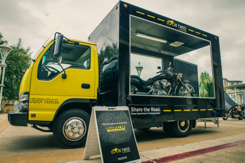 TxDOT's glass-panel truck is traveling across Texas to promote motorcycle safety awareness. People can go inside the truck and have their pictures taken on the motorcycle. (Photo: Business Wire)