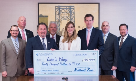 Combined Insurance's Northeast zone sales and military hiring program executives present Luke's Wings with a $30,000 donation - the charity's fifth largest to date. L-R: Adam Paddock, executive market director, Combined Insurance; Tim Kennedy, market director, Combined Insurance; Greg Thompson, senior vice president and Northeast zone manager, Combined Insurance; Bob Smith, senior executive market director, Combined Insurance; Lindsay Gill, executive director, Luke's Wings; Fletcher Gill, co-founder and CEO, Luke's Wings; Art Kandarian, vice president sales and military markets, Combined Insurance; and Rich Davis, senior executive market director, Combined Insurance. (Photo: Business Wire)