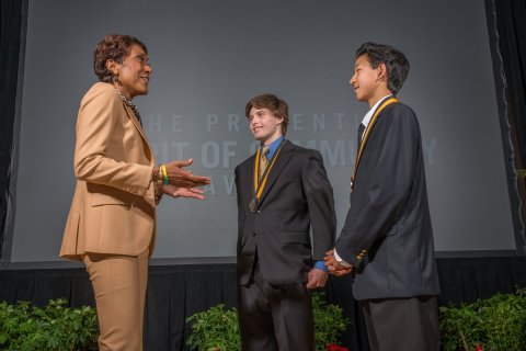 "Good Morning America" co-anchor Robin Roberts congratulates Cullen Corr, 17, of Irving (center) and Eric Li, 14, of Manvel (right) on being named Texas' top two youth volunteers for 2015 by The Prudential Spirit of Community Awards. Cullen and Eric were honored at a ceremony on Sunday, May 3 at the Smithsonian's National Museum of Natural History, where they each received a $1,000 award. (Photo: Zach Harrison Photography)