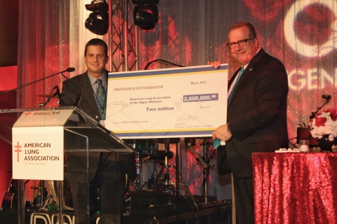 Dustin Hinton, president and CEO, UnitedHealthcare of Wisconsin, presents Lew Bartfield, president and CEO, American Lung Association of the Upper Midwest, with a $2 million grant from United Health Foundation during the American Lung Association in Wisconsin's annual gala Saturday, May 2 (Photo: Dave Jonasen).