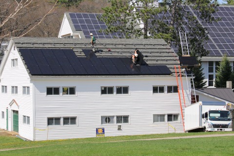 Solar panels being installed at Proctor Academy in Andover, NH. (Photo: Business Wire)