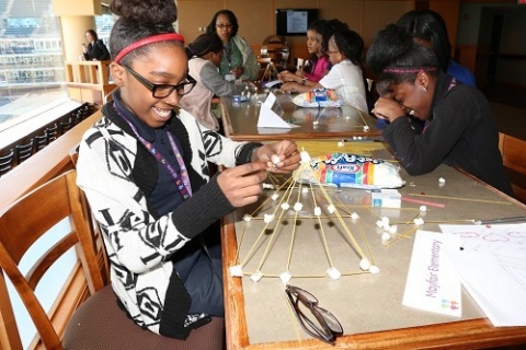 GE Girls enthusiastically work on final watchtower project at the GE Girls End-of-Year Summit at Progressive Field. (Photo: General Electric)