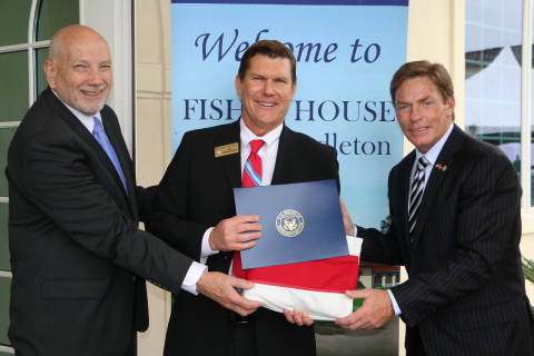 Bill Christiansen, representing the Office of Congressman Darrell Issa, presents a United States flag to VADM John. M. Mateczun, USN (Ret), President of UnitedHealthcare Military & Veterans (left), and Mr. Kenneth Fisher, Chairman and CEO of Fisher House Foundation (right) in honor of the opening of the Fisher House at Camp Pendleton. The flag was flown over the U.S. Capitol Building in honor of Fisher House at Camp Pendleton (Photo: Jamie Rector).