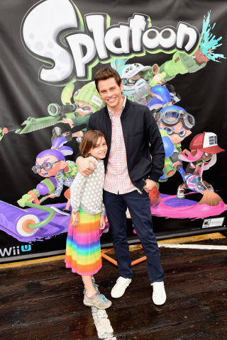 In this photo provided by Nintendo of America, James Marsden from Anchorman 2: The Legend Continues and his daughter Mary attend Nintendo's colorful Splatoon Mess Fest event at the Santa Monica Pier on May 15, 2015.