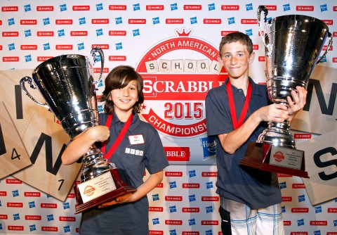 Teammates Noah Kalus, right, from New Paltz, N.Y. and Zach Ansell, left, from Los Angeles, Calif., pose for photos after winning the 2015 North American School SCRABBLE Championship, at Hasbro headquarters in Pawtucket, R.I., Sunday, May 17, 2015. Kalus and Ansell won, 587 to 331, over a team from Chapel Hill, N.C. (Stew Milne/AP Images for Hasbro)