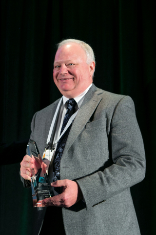 Frank Racek, Presiding Judge of North Dakota's East Central Judicial District accepts a Tyler Excellence Award at Connect, Tyler's annual user conference. (Photo: Business Wire)