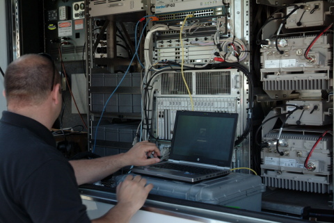 A Sprint Employee Response Team (ERT) member monitors cellular communications on a Satellite Cell on Light Truck (SatCOLT). (Photo: Business Wire)