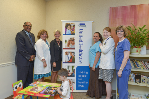 Left to right: Dr. John Rennick, Market Medical Director, UnitedHealthcare; Tamara Withers-Thompson, RN, Clinic Manager, Charlotte Community Health Clinic; Anita Bachmann, Vice President, UnitedHealthcare; Ana Ulloa, CMA, Charlotte Community Health Clinic; Danielle Kelly, PNP, Charlotte Community Health Clinic; and Susan Pascal, RN, Charlotte Community Health Clinic gather around the recently donated Sesame Street reading corner by UnitedHealthcare. UnitedHealthcare is donating Sesame Street reading corners to 12 Federally Qualified Health Centers (FQHCs) throughout North Carolina to encourage young children to read and learn more about healthy living (Photo: Pam Brackett).