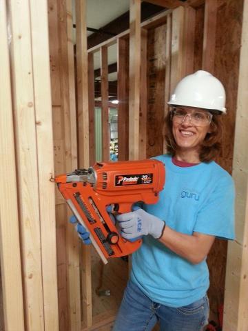 American Modern employee Catalina Stancescu working on the construction of a two-story home inside the company's nearly 50,000 square foot claims training facility in Amelia, OH. (Photo: Business Wire)