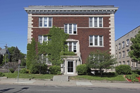 Exterior photograph of an historic Stevens Square apartment building, located at 1926 Third Avenue South in Minneapolis. UnitedHealth Group is providing $1.9 million in equity through a partnership with MEF to help transform the 100-year-old property into a new 19-unit affordable-housing community with support services for area homeless and people in need of permanent housing (Photo: Greg Page).