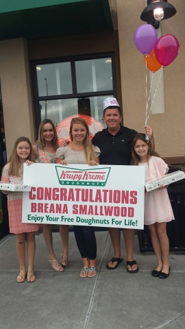 Breana Smallwood of Fuquay Varina, NC claims the grand prize of Doughnuts for Life from Krispy Kreme. (Photo: Business Wire)