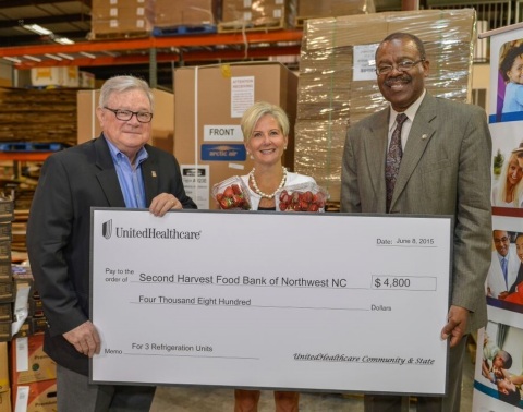 Anita Bachmann of UnitedHealthcare (center) presents a check for three refrigeration units to Clyde Fitzgerald, executive director, Second Harvest Food Bank of Northwest North Carolina (left) and Representative Ralph C. Johnson (District 58) during a special presentation at Second Harvest Food Bank. With more than 340 food deserts across 80 counties in the state, limited access to nutritious foods is a major issue statewide and particularly in the Triad. UnitedHealthcare has partnered with organizations like the Second Harvest Food Bank to reduce food insecurity across North Carolina and help people live healthier lives (Photo: Pam Brackett).