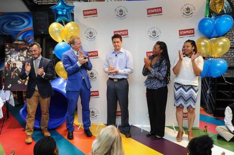 Sasha Barausky, Director of Product Management at Staples, center, presents Ron Clark of Ron Clark Academy, second from left, and teachers Wade King, left, Pamela Haskins, and Susan Barnes, right, a $50,000 donation from Staples, Thursday, June 11, 2015, in Atlanta, after the students participated in Staples’ first-ever “Designed by Students” program. (Photo by John Amis/Invision for Staples/AP Images)