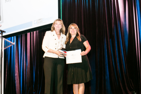 Pamela Wickham, vice president, corporate affairs & communications at Raytheon Company, accepts the 2015 John J. Molloy Crystal Bell Lifetime Achievement Award from the Publicity Club of New England's president, Karyn Martin. (Photo: Business Wire)