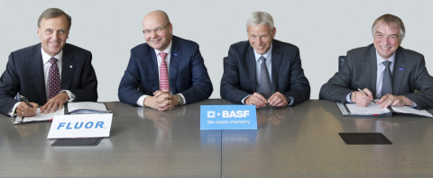 Fluor COO Peter Oosterveer signs global agreement with BASF executives. (Photo: Business Wire)
