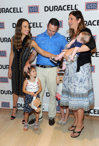 Hilary Swank, left, actress and daughter of a retired Air Force Senior Master Sergeant, greets Robert and Denise Nilson and their children, the military family that inspired the new Duracell film, The Teddy Bear, Thursday, July 2, 2015, at The Times Center in New York. The film was released in time for the July Fourth holiday weekend and can be viewed at youtube.com/Duracell. (Photo by Diane Bondareff/Invision for Duracell/AP Images)