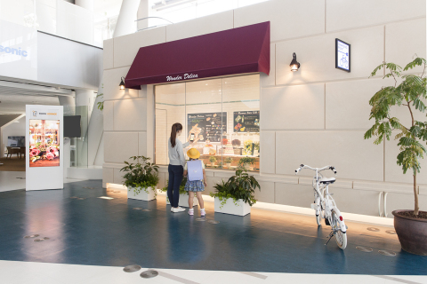 Future Shopping at Town: You can easily obtain information about stores and products by simply holding your mobile terminal against signage and lights in the town. You can order products on the spot or enjoy clipped information at home. (Photo: Business Wire)