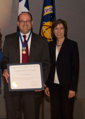 Orbital ATK's Frank DeMauro receives the NASA Exceptional Public Service Medal from Johnson Space Center Director Ellen Ochoa. (Photo: Business Wire)