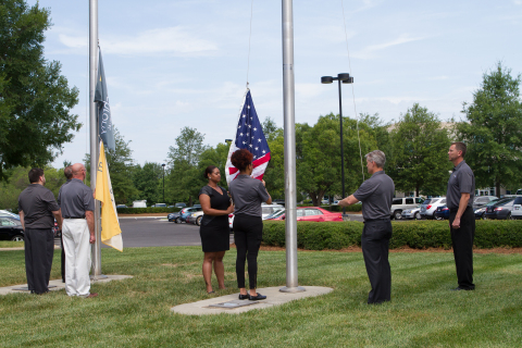Members of Synchrony Financial’s Veteran’s Network raise the American and Synchrony Financial flags  ... 