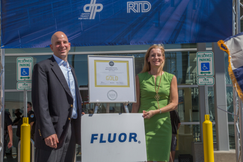 (L-R) Aaron Epstein, executive project director of the Fluor-led Denver Eagle P3 Project, and Lisa Bottle, Fluor's vice president of corporate communications, celebrate LEED Gold certification for the Regional Transportation District's commuter rail maintenance facility on Saturday, July 25, in Denver. (Photo: Business Wire)