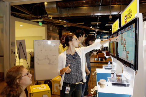 In this photo provided by Nintendo of America, Gina Policelli of Facebook designs a level in the Super Mario Maker game during a special "hackathon" event hosted by Nintendo at Facebook HQ in Menlo Park on Wednesday, July 29, 2015. The winning level will be available for Super Mario Maker owners to download and play shortly after the game's launch on the 11th of September. (Photo by Alison Yin/Invision for Nintendo/Facebook/AP Images)