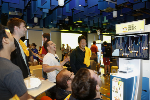 In this photo provided by Nintendo of America, Facebook employees play a level developed during a "hackathon" event for the Super Mario Maker game hosted by Nintendo at Facebook HQ in Menlo Park on Tuesday, July 28, 2015. The winning level will be available for Super Mario Maker owners to download and play shortly after the game's launch on the 11th of September. (Photo by Alison Yin/Invision for Nintendo/Facebook/AP Images)